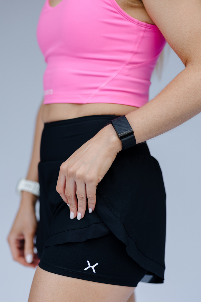 Black running shorts with pink bra 